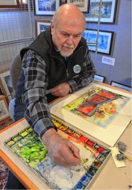 Walter Cudnohufsky works on a painting of the William Cullen Bryant Homestead barn at his studio in Ashfield, Friday, March 18.